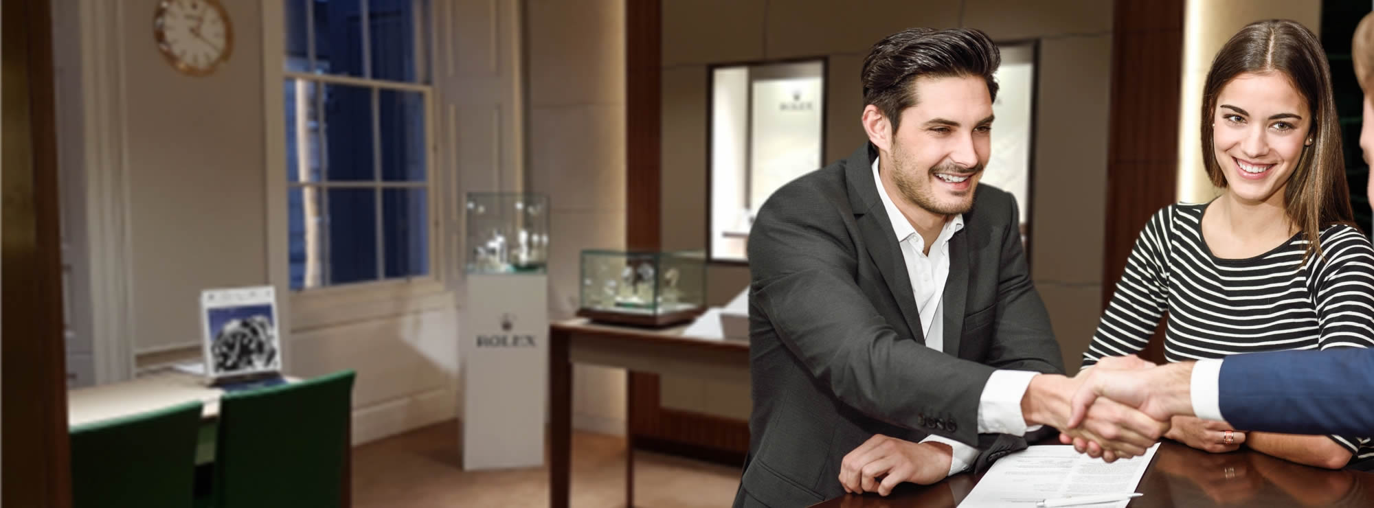 A JAW Associate Gemmologist with a gemological microscope